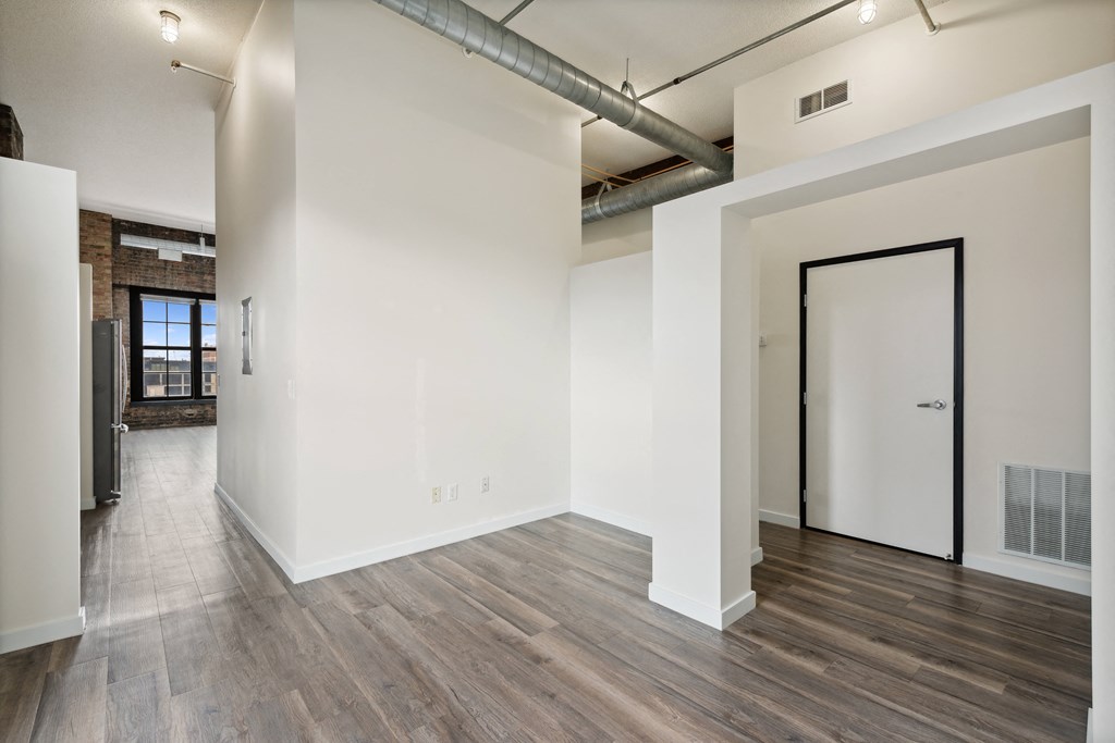 the living room with wood floors and white walls at Gaar Scott Historic Lofts, Minnesota, 55401