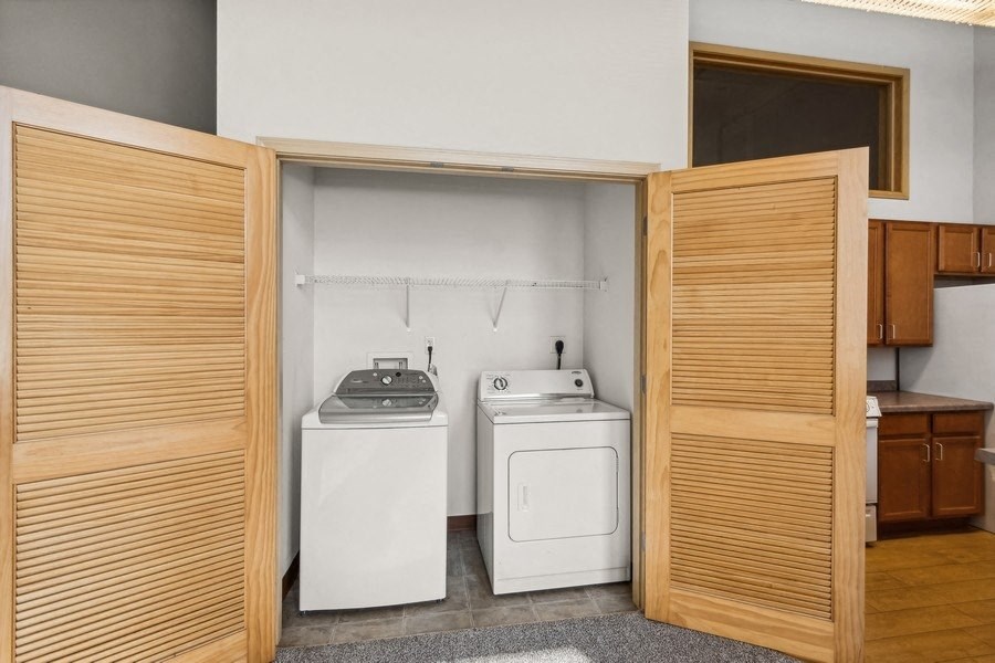 a laundry room with a washing machine and a dryer in it