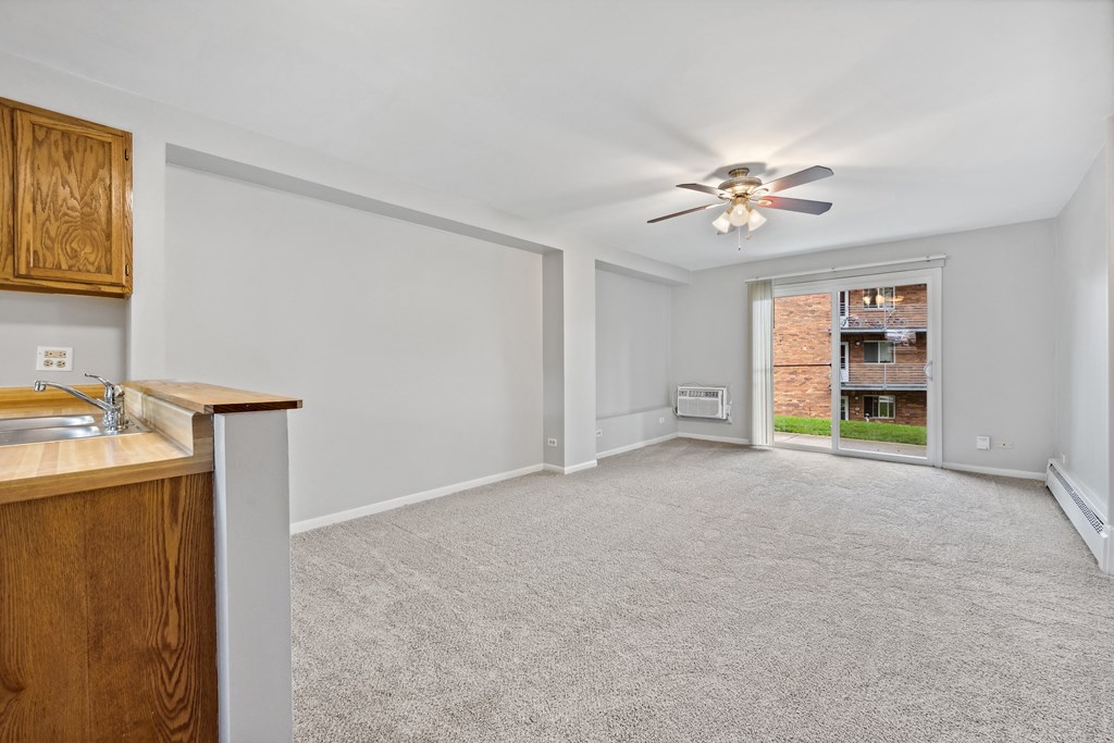 White interior with wooden cabinets at River Oaks, North Aurora, IL