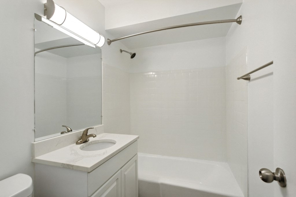 a bathroom with a sink and a bathtub at The Hinsdale, Illinois, 60521