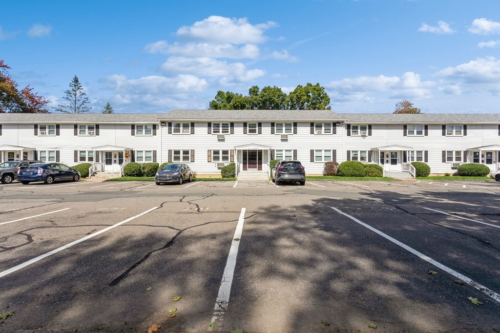 parking lot in front of white apartment building at Fox Hill Commons, Vernon, 06066