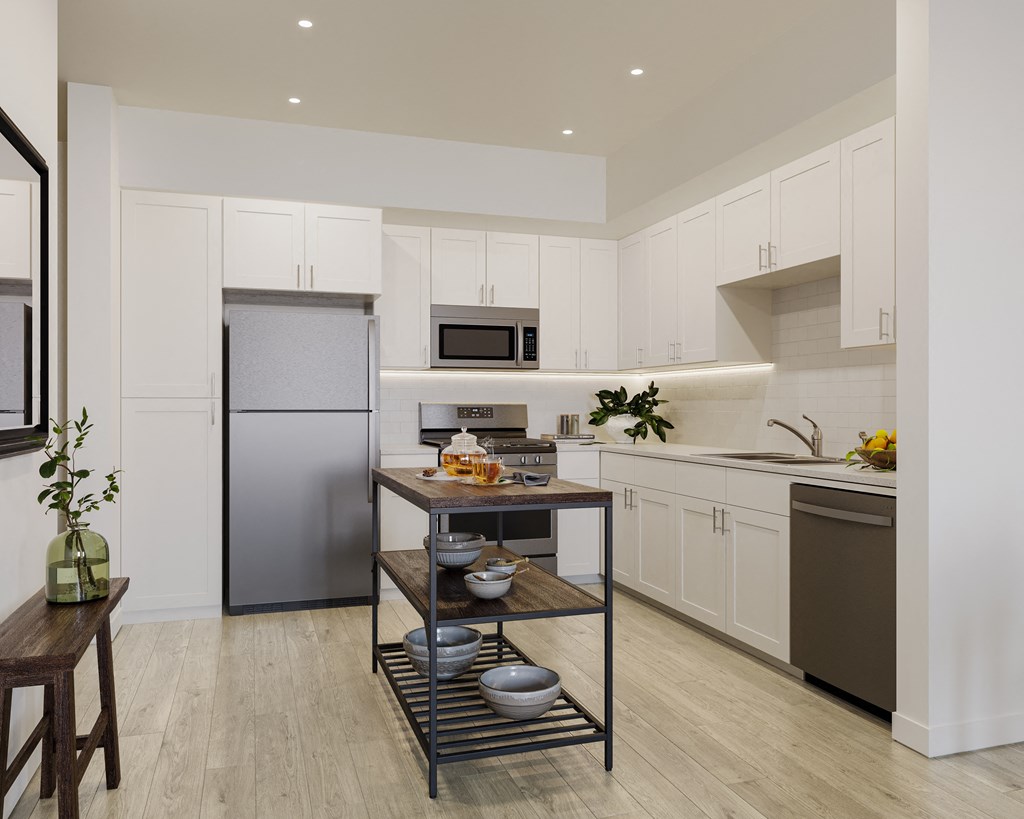a kitchen with white cabinets and stainless steel appliances and a center island at Arrive Temecula, Temecula, 92591