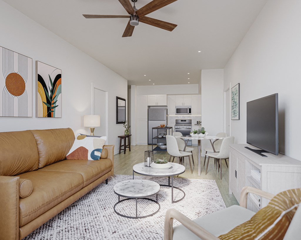 a living room with a leather couch and a tv at Arrive Temecula, Temecula California