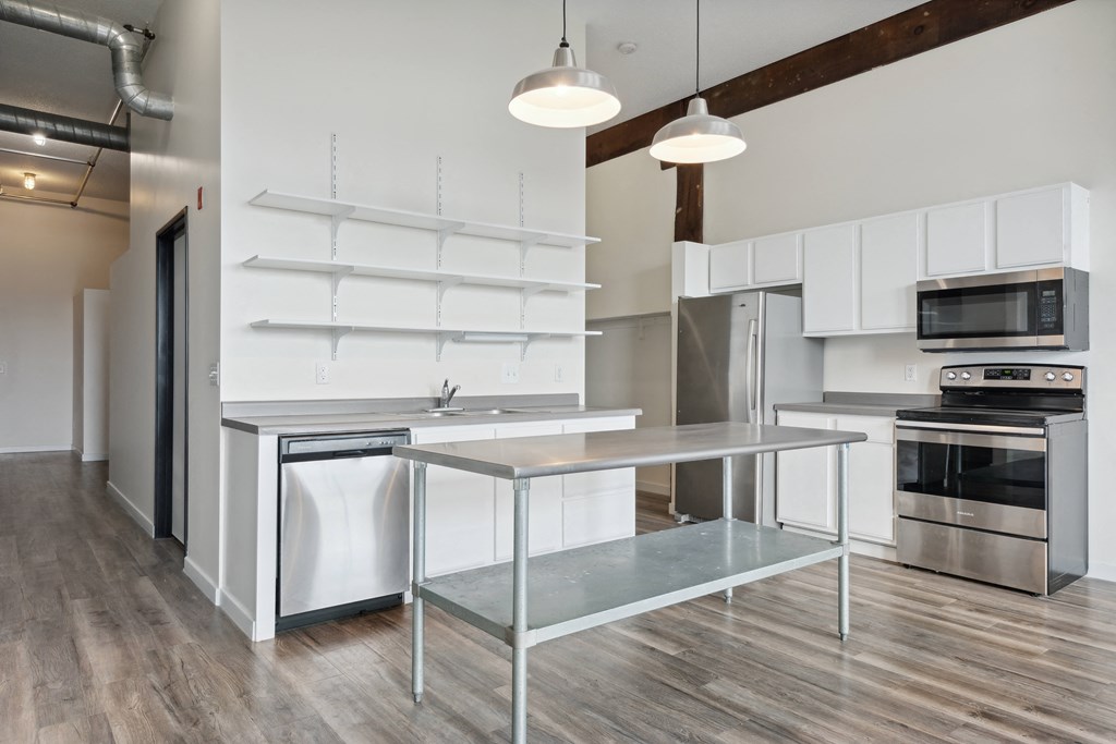 a kitchen with white cabinetry and stainless steel appliancesat Gaar Scott Historic Lofts, Minnesota, 55401