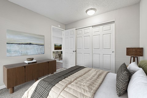 A bedroom with a bed, a dresser, and a painting on the wall.