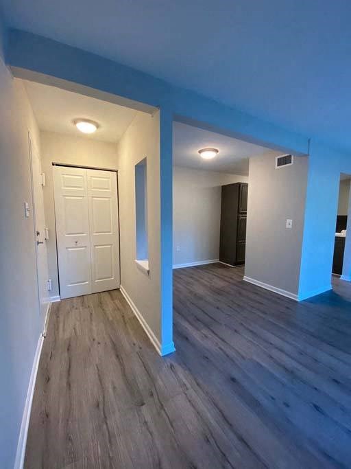 a empty room with a white door and blue walls at ReNew Odenton, Odenton