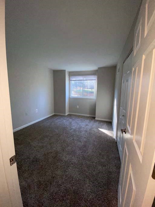 an empty room with a white door and a window at ReNew Odenton, Odenton