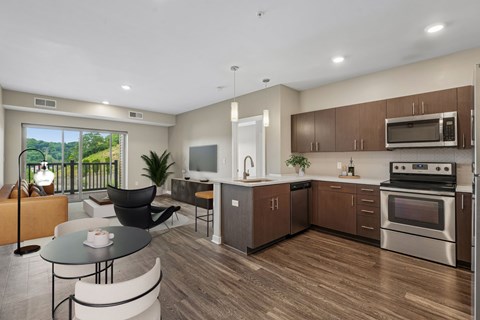 A modern kitchen with a dining table and chairs.