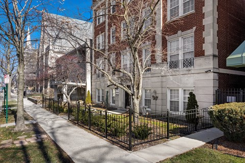 A tree-lined exterior of Pleasant Oaks at Pleasant Oak Apartments, Oak Park