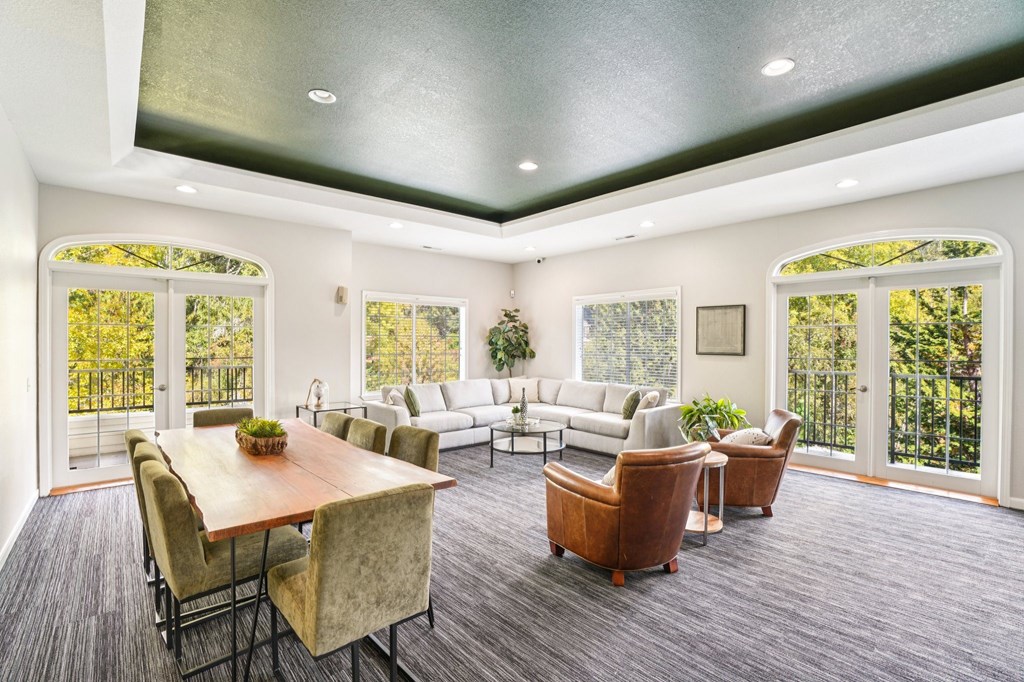 A sitting room with a wooden table and chairs.