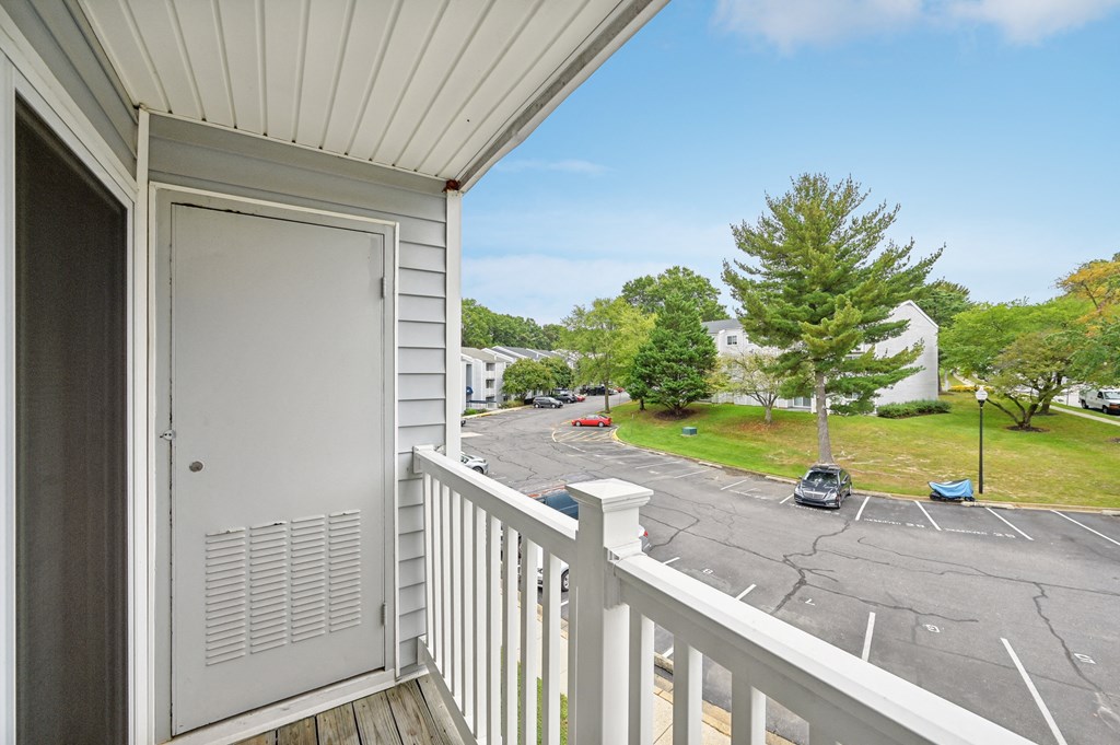 the view from the balcony of a residence with a door at ReNew Odenton