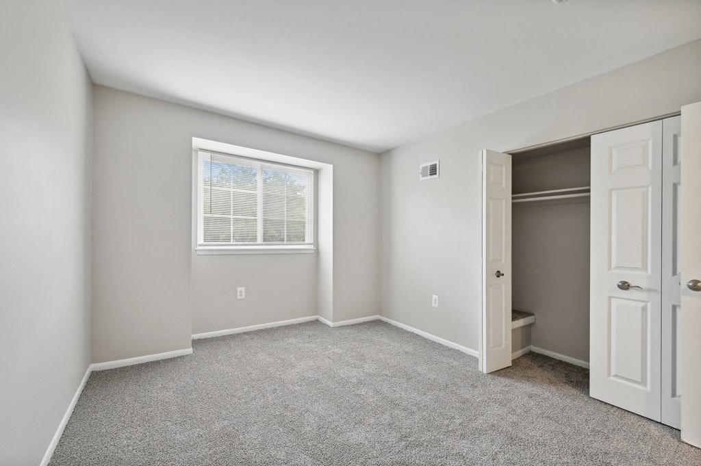 an empty bedroom with a closet at ReNew Odenton