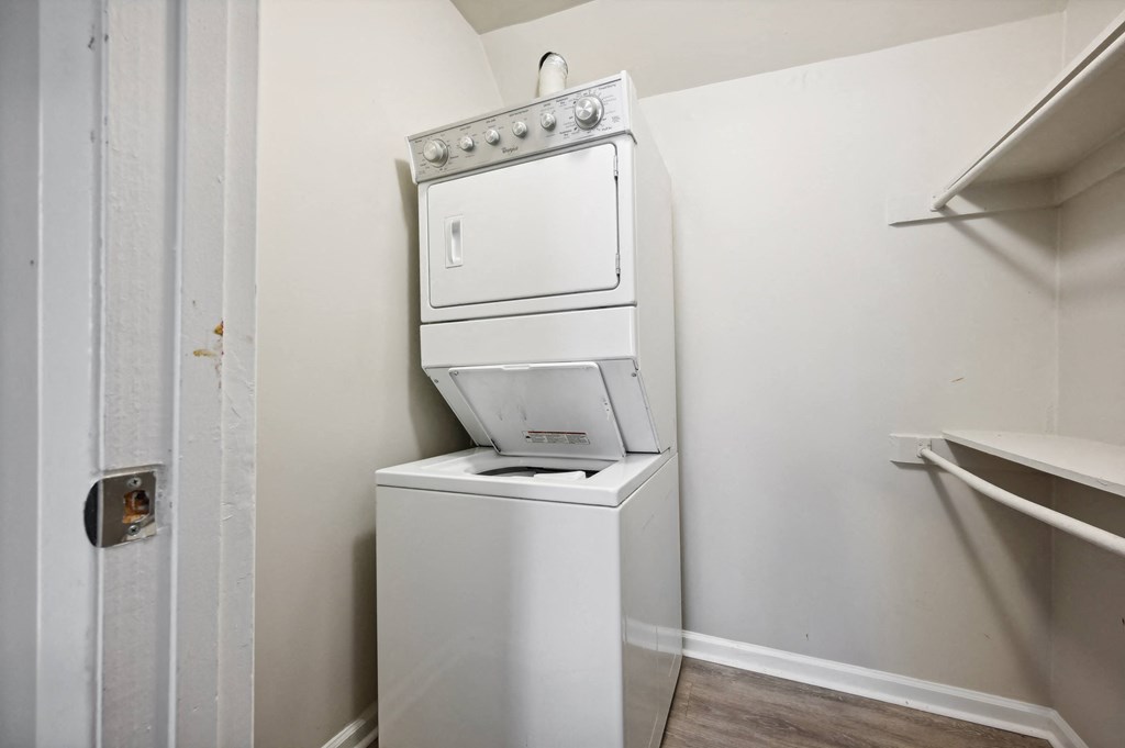 a white washer and dryer in a room with a white wall at ReNew Odenton