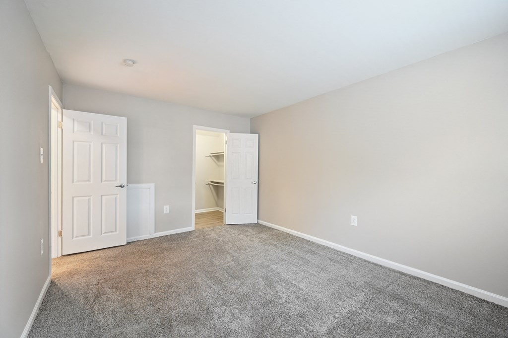 An empty bedroom with white door at ReNew Odenton