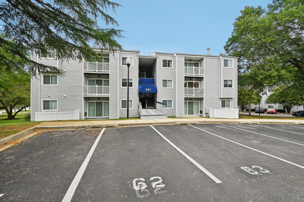 ReNew Odenton apartment building with a parking lot and stairs