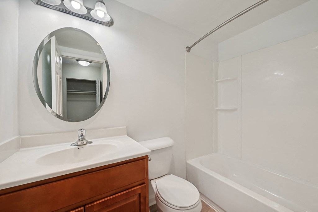 a bathroom with a sink toilet and a bath tub at ReNew Odenton