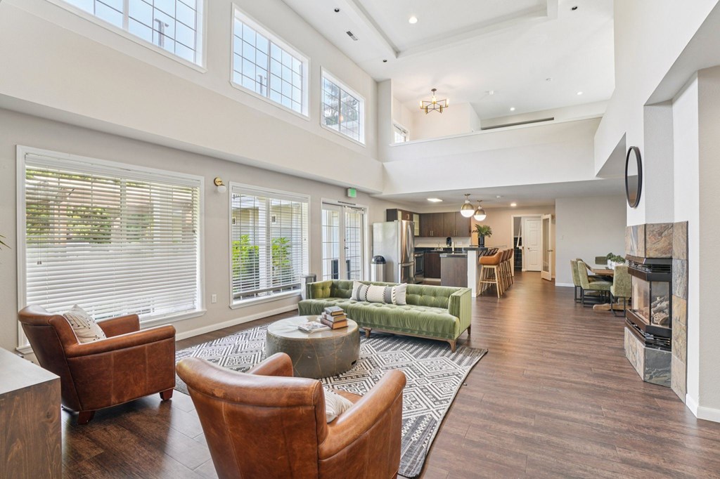 A sitting room with a fireplace and a couch.