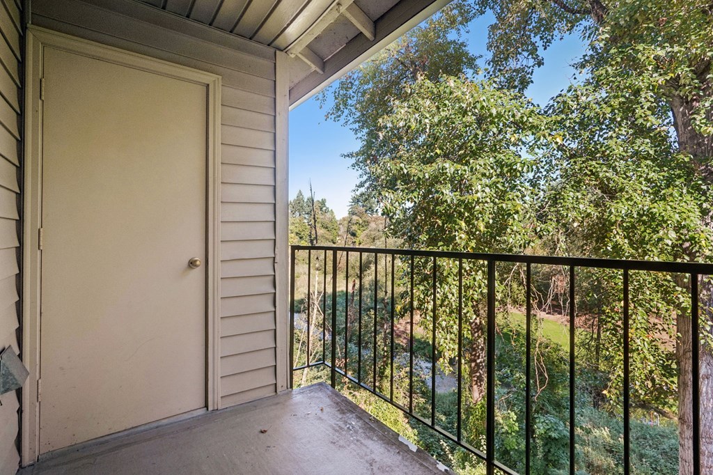 Balcony with view of trees