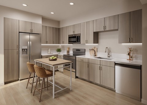 A modern kitchen with a table and chairs.