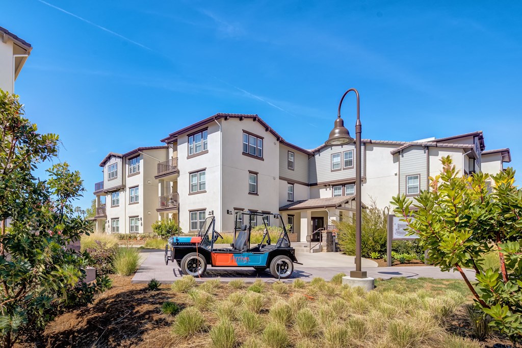 a jeep parked in front of an apartment building