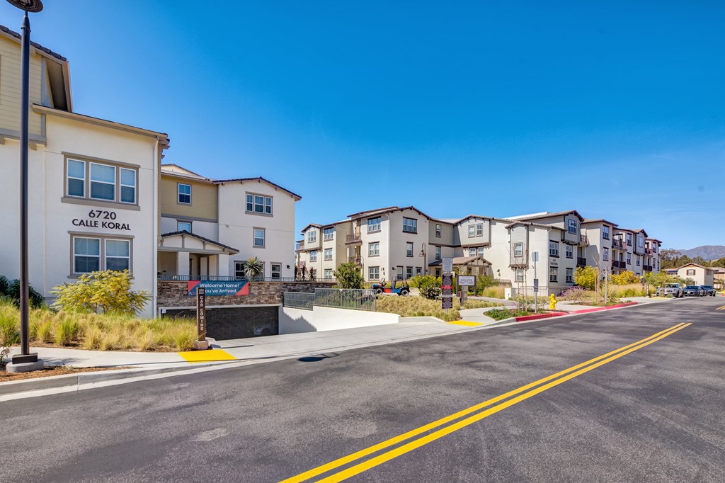 a street with a row of houses on the side of the road
