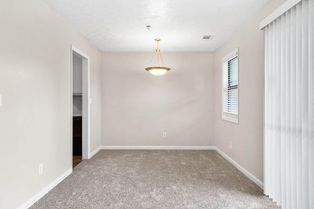 a bedroom with a large window and a chandelier at Alcovy Terrace, Georgia