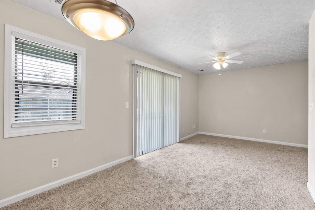 an empty room with a window and a ceiling fan at Alcovy Terrace, Covington, Georgia, 30014