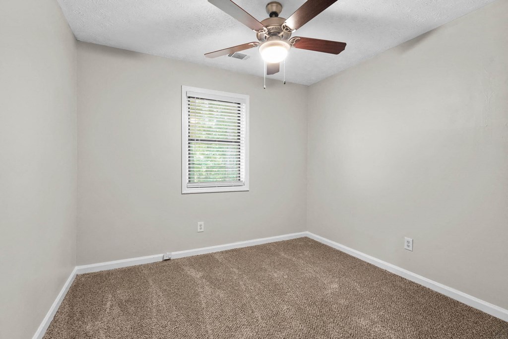 a bedroom with a ceiling fan and a window at Alcovy Terrace, Covington, GA, 30014