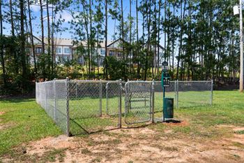 the gate into the dog park at the apartments for rent