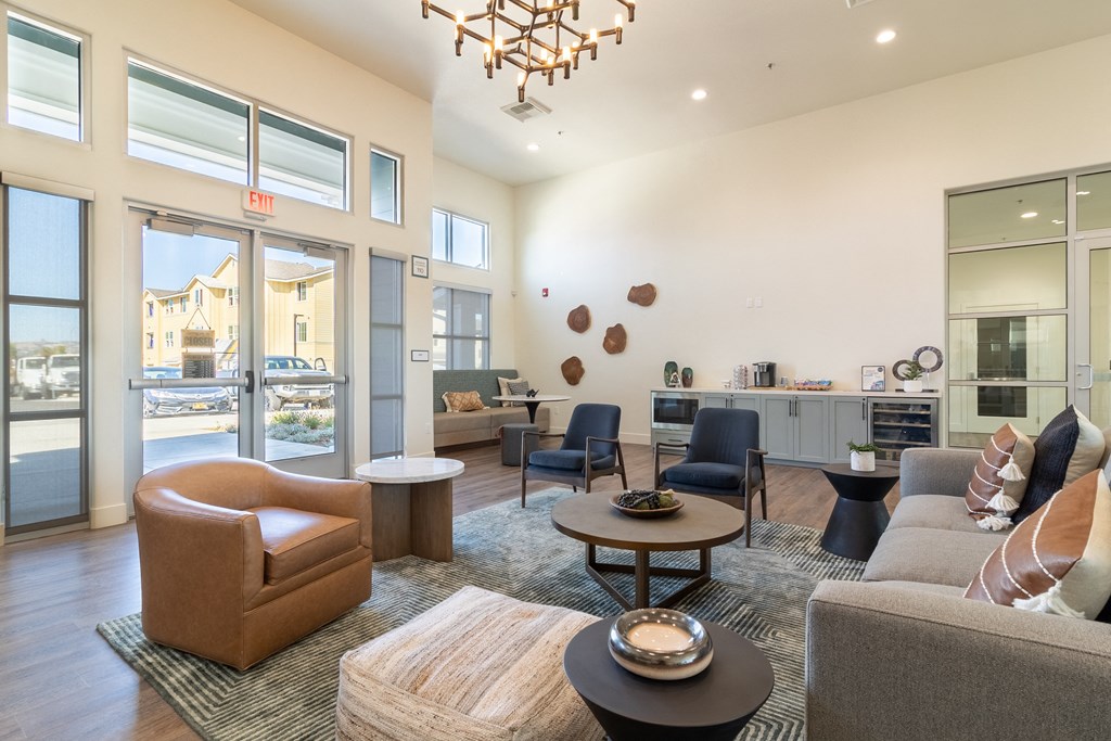 A clubroom with a couch and a chair and a table at Arrive Paso Robles, California
