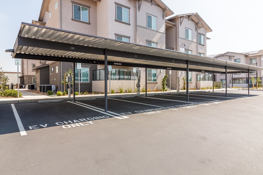 A parking lot with carports.