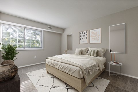Bedroom with bed and nightstand at Briarwood Apartments, Dumfries, VA, 22026