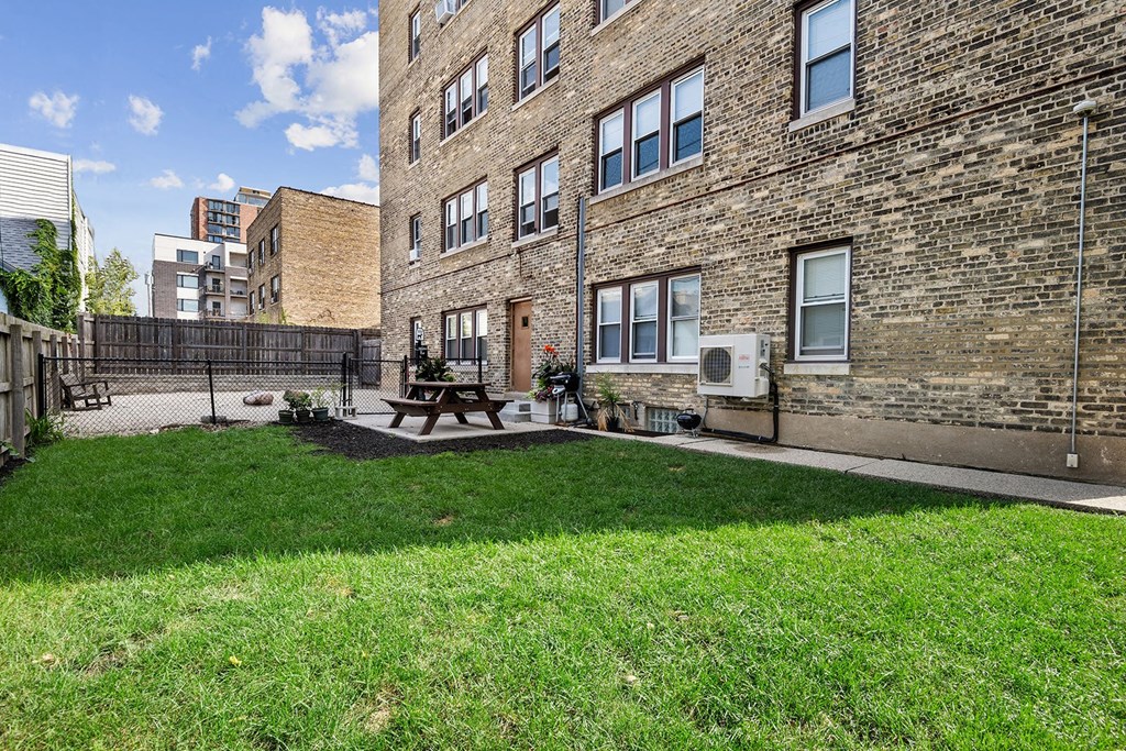 the yard of Cambridge manor with picnic area and dog park