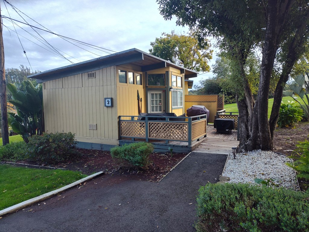 Cabin with a porch and driveway at Salinas Sunset Apartments, Salinas, CA, 93907