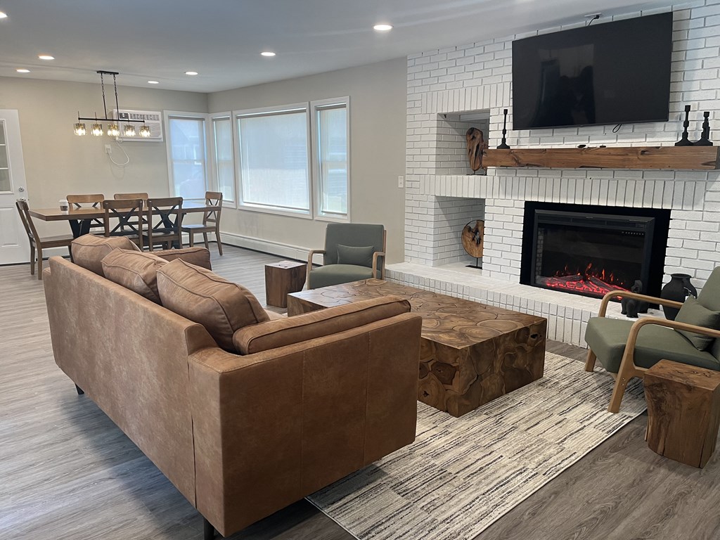 Clubhouse with a fireplace and a television