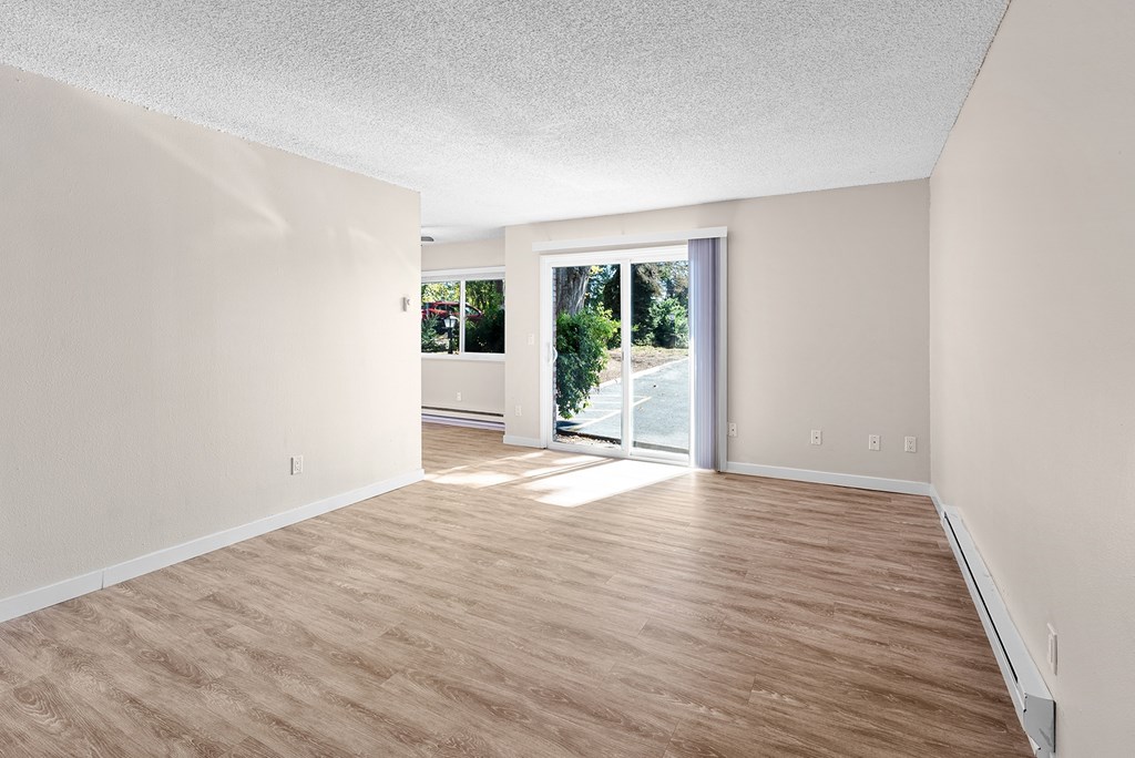 living room with wooden floors and a glass sliding door