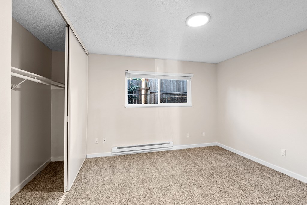 Bedroom with a window and a closet