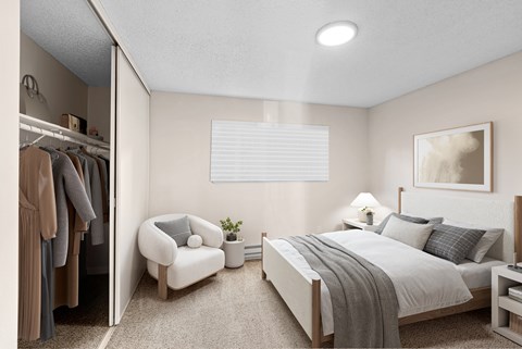A bedroom with a large bed, a chair, and a closet with clothes.