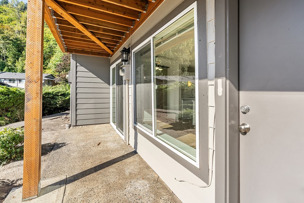 Apartment entrance with a grey door and windows