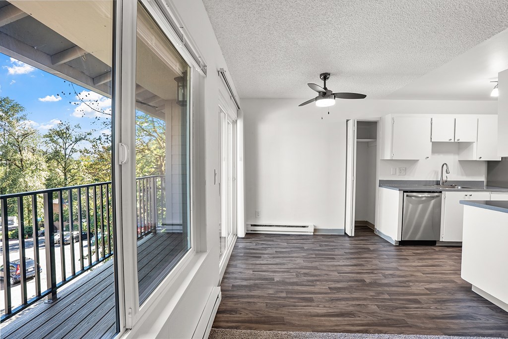 View of the kitchen with wooden floor and window