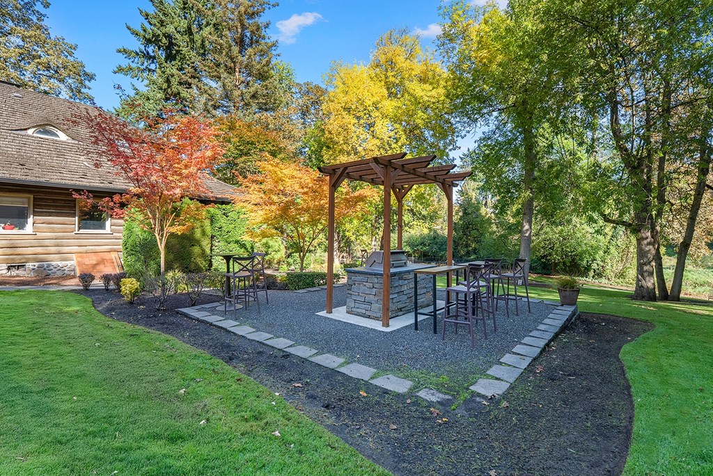 Green area with a bbq station and trees