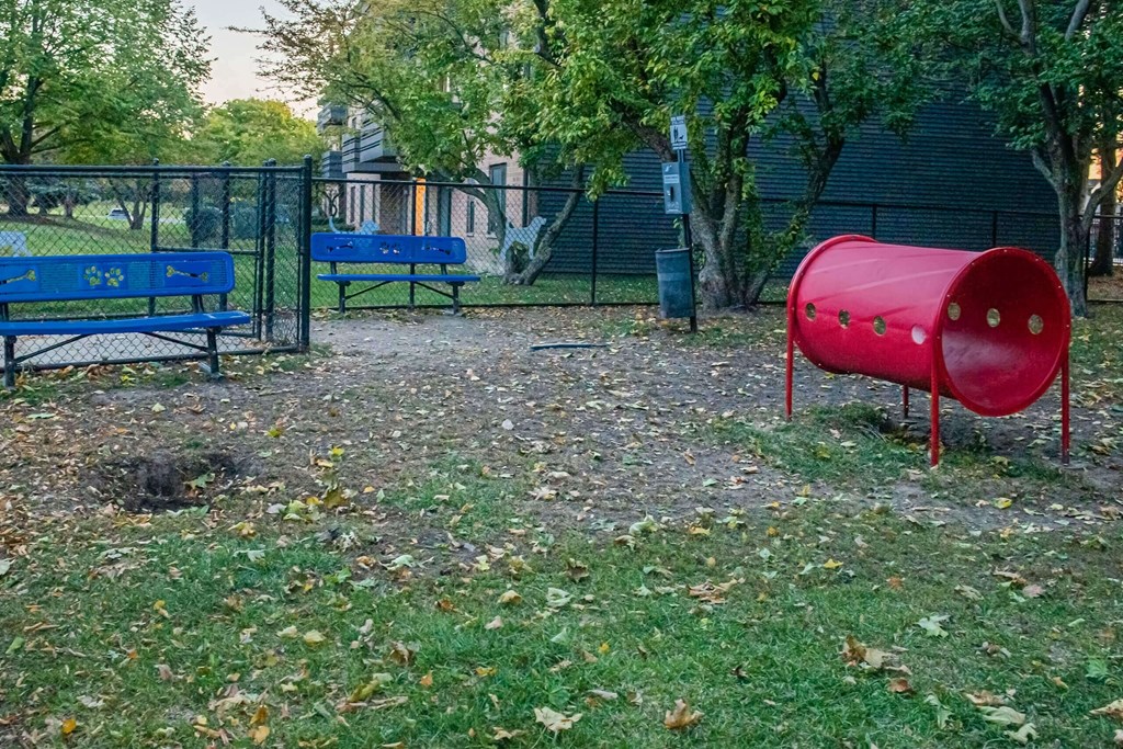a red container sitting on top of at Fifteen 98 Naperville, Naperville, 60563 a lush green field at Fifteen 98 Naperville, Naperville