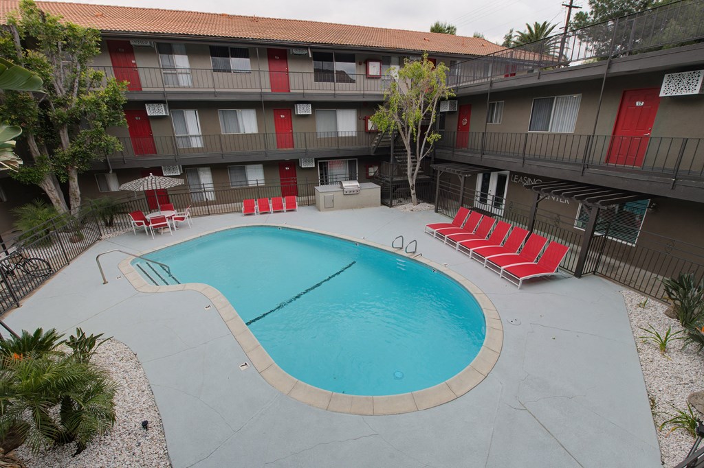 our apartments showcase an unique swimming pool at Dwell Apartment Homes, Riverside, CA