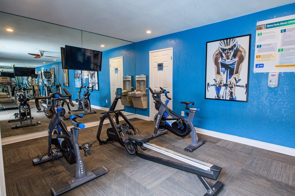 the gym at the enclave at woodbridge apartments in sugar land, tx at Dwell Apartment Homes, Riverside, California