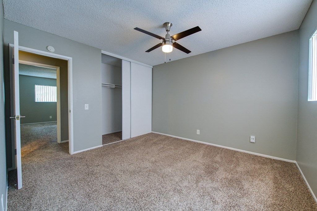 an empty bedroom with a ceiling fan at Dwell Apartment Homes, Riverside, CA, 92507