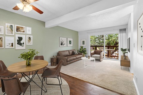A living room with a brown table and chairs.