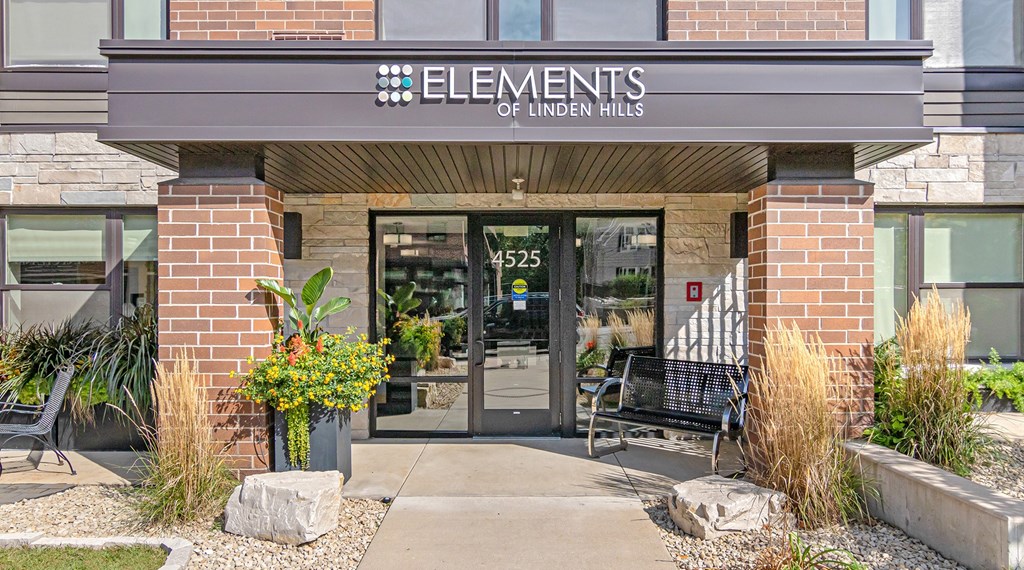 The front of a building with the name Elements of Linden Hills on it.