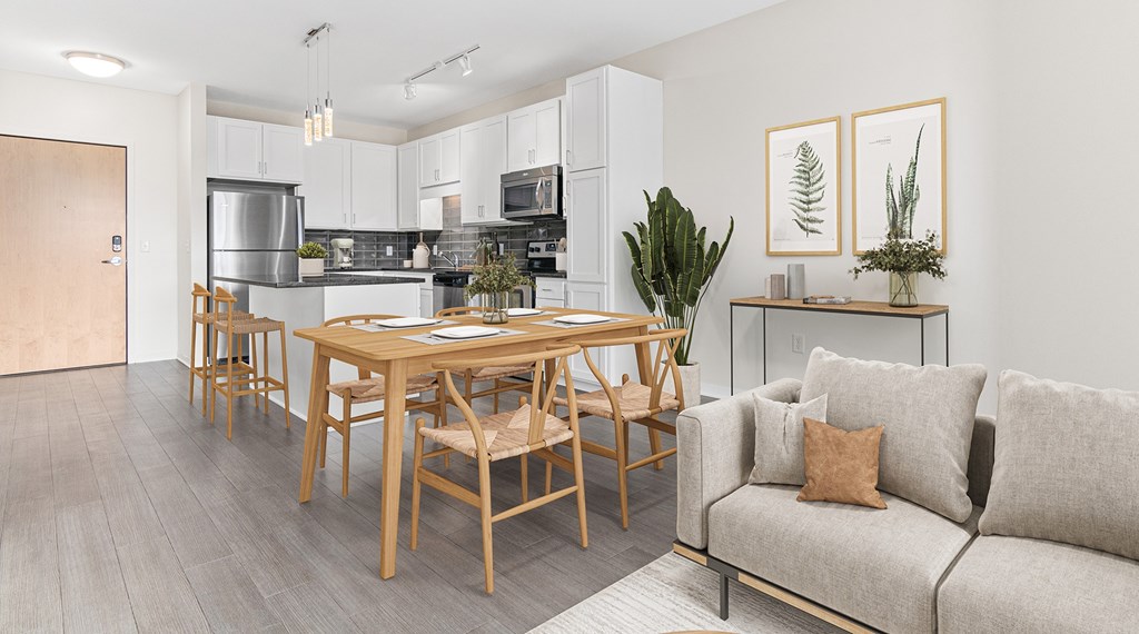 A modern kitchen with a dining table and chairs.