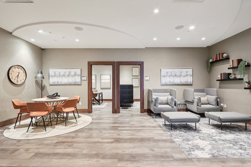 a room with couches and chairs and a table