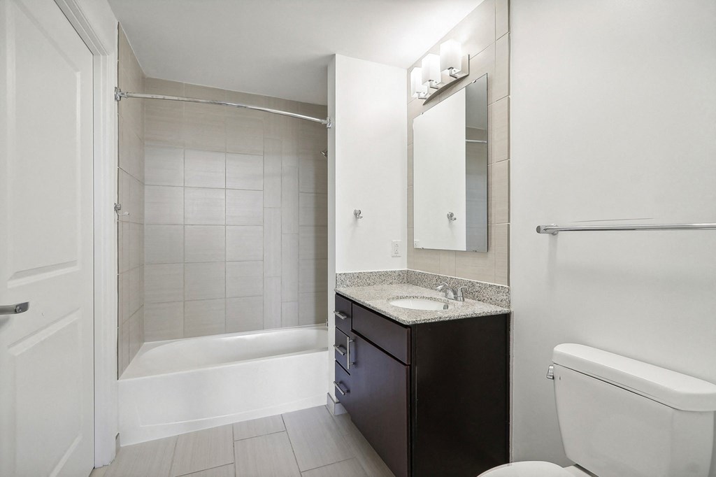 a bathroom with a sink toilet and a shower